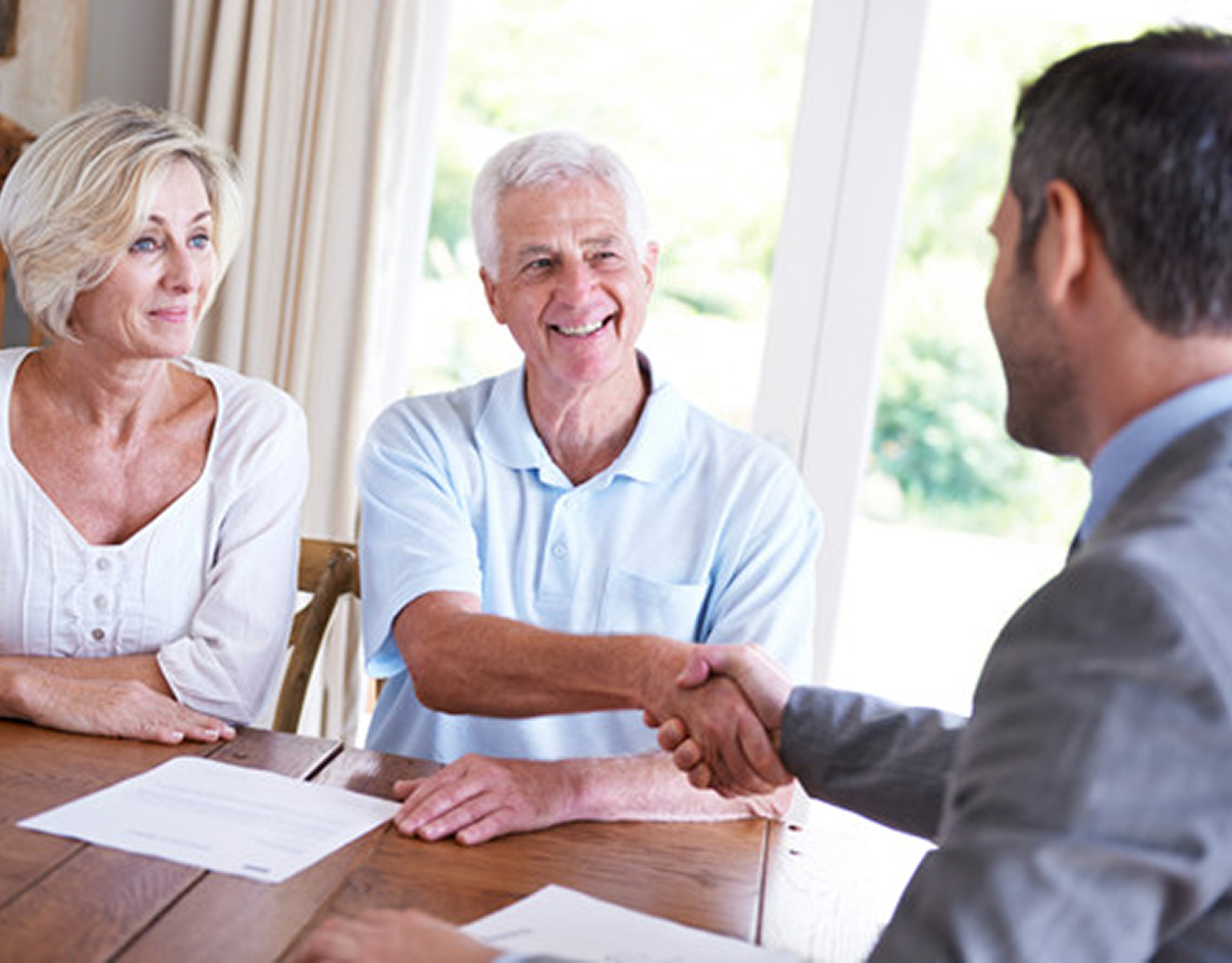 Senior couple meeting with a professional advisor.