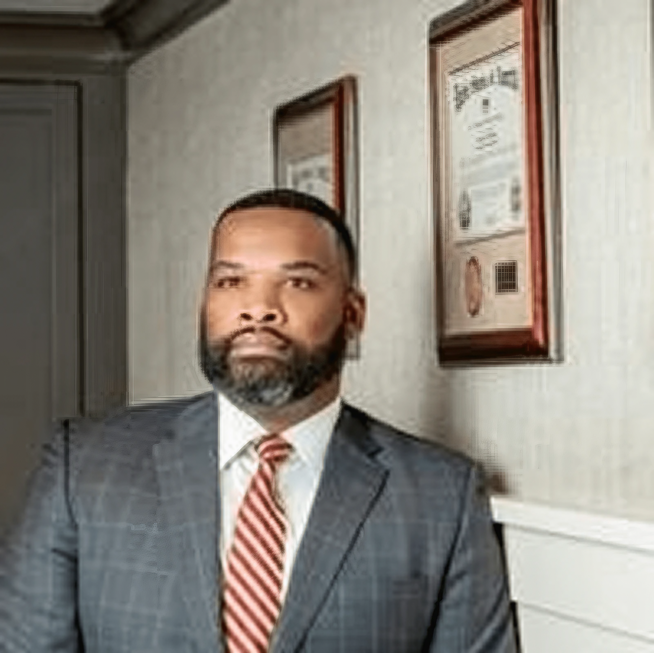 Businessman standing by wall diplomas