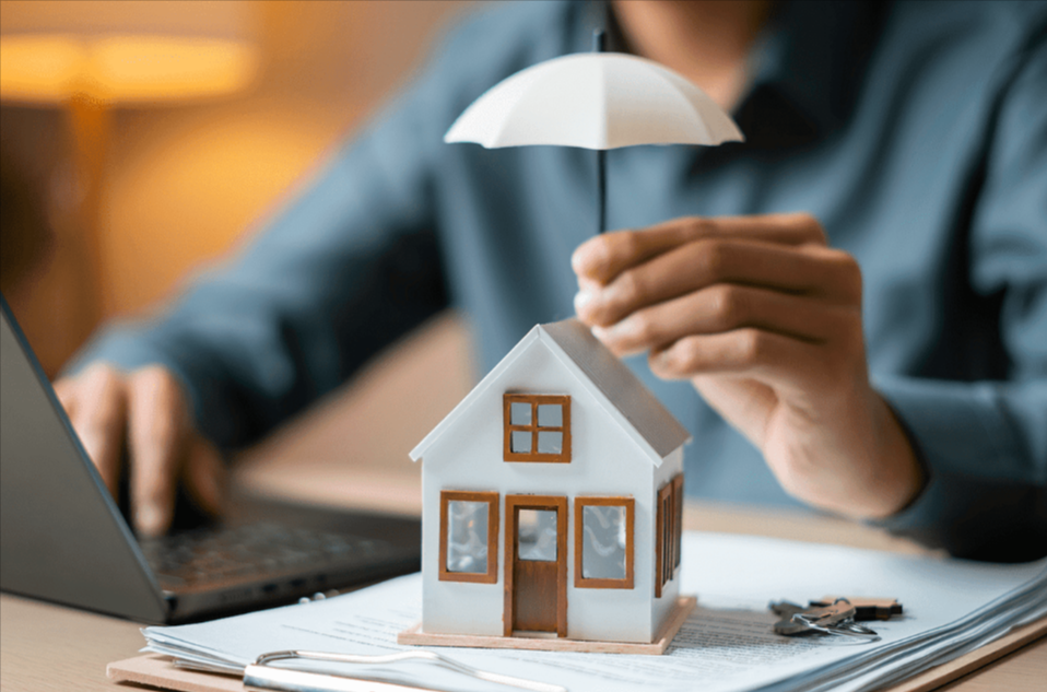 Model house under umbrella for protection