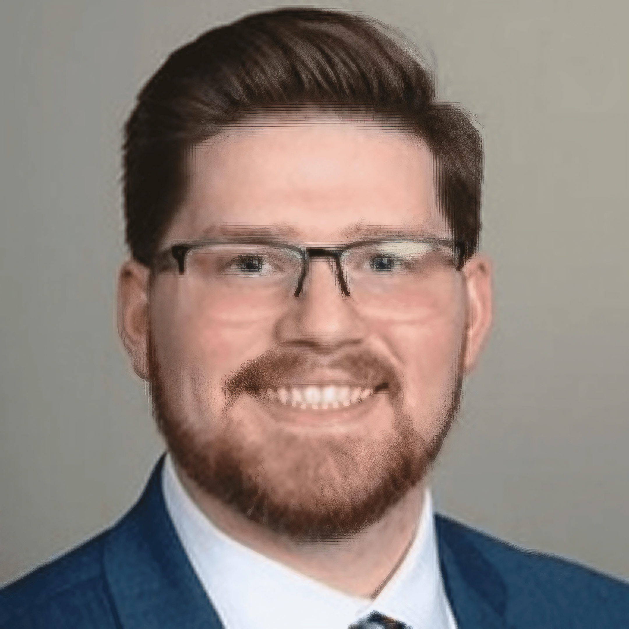 Smiling man in a blue suit