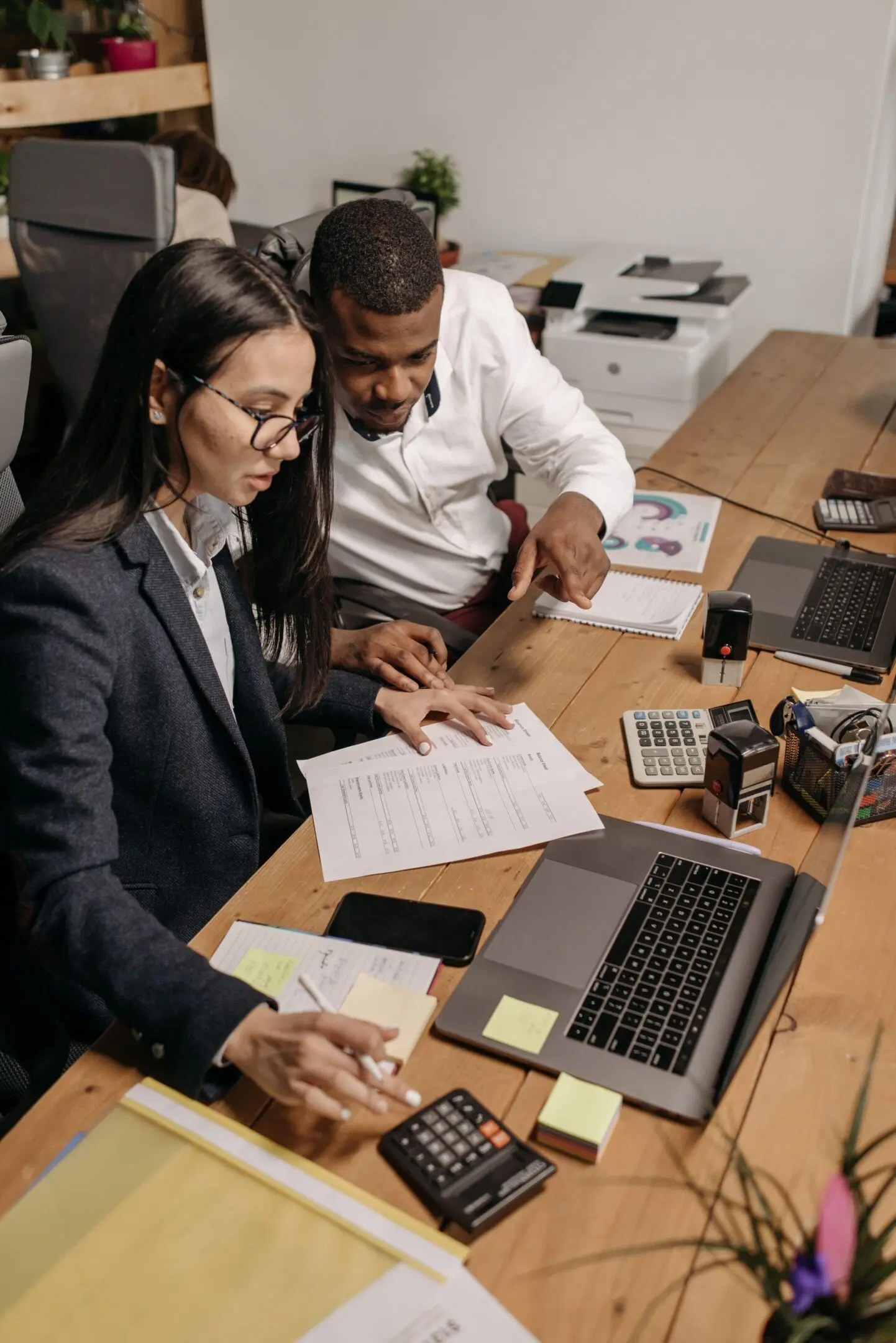 Man and woman discussing documents