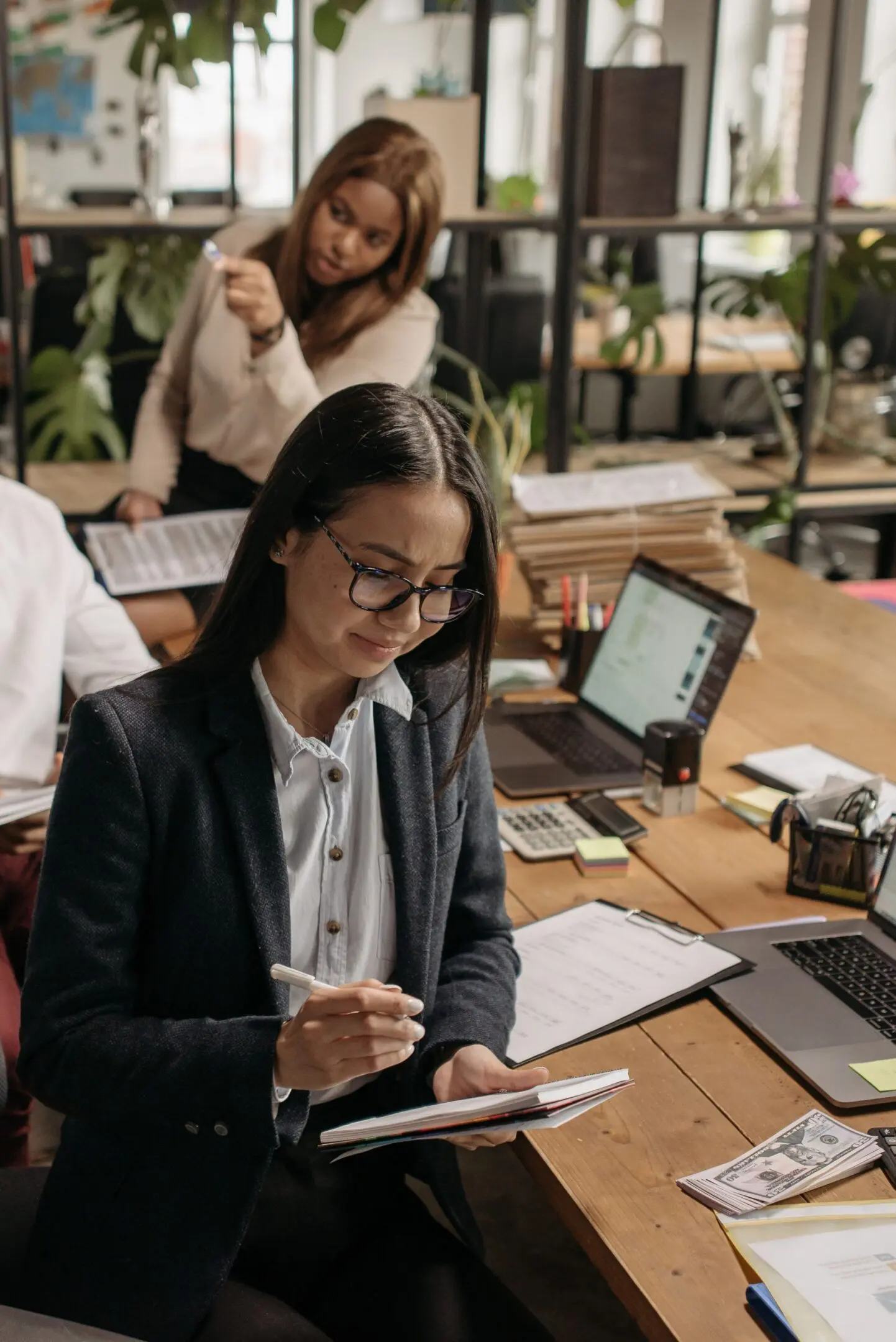 Colleagues working at shared desk