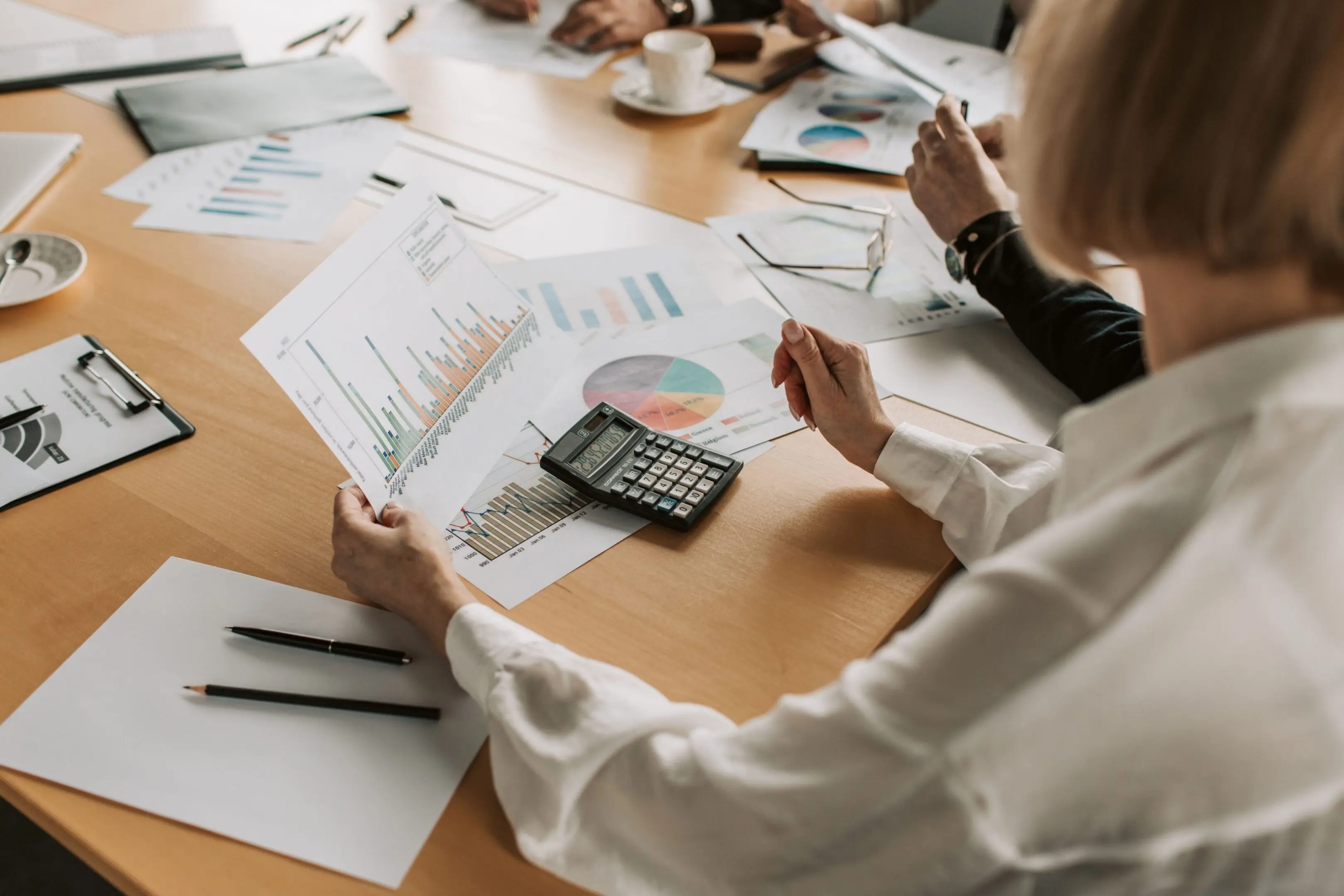 Business meeting with charts and data