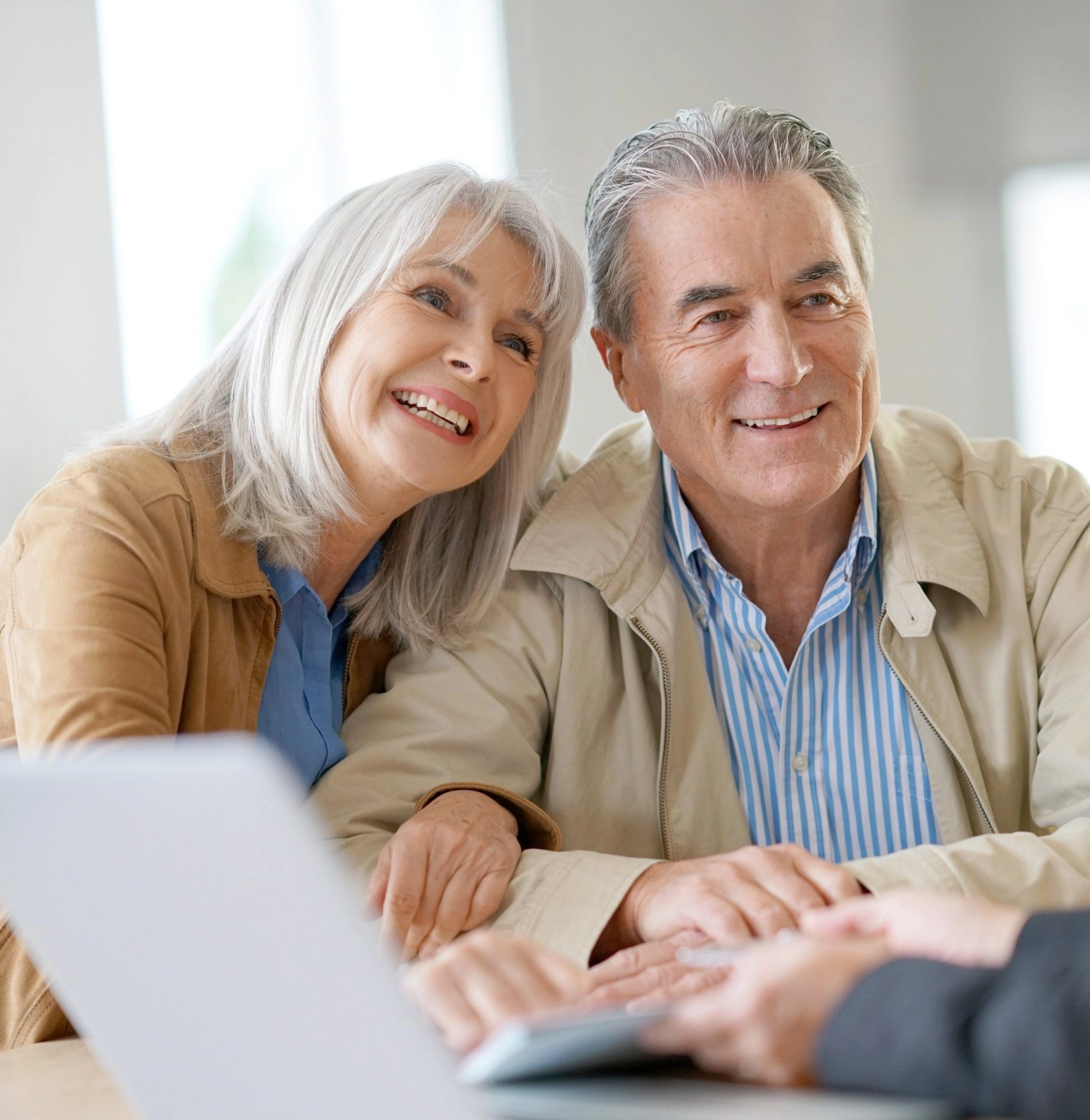 Happy older couple at consultation