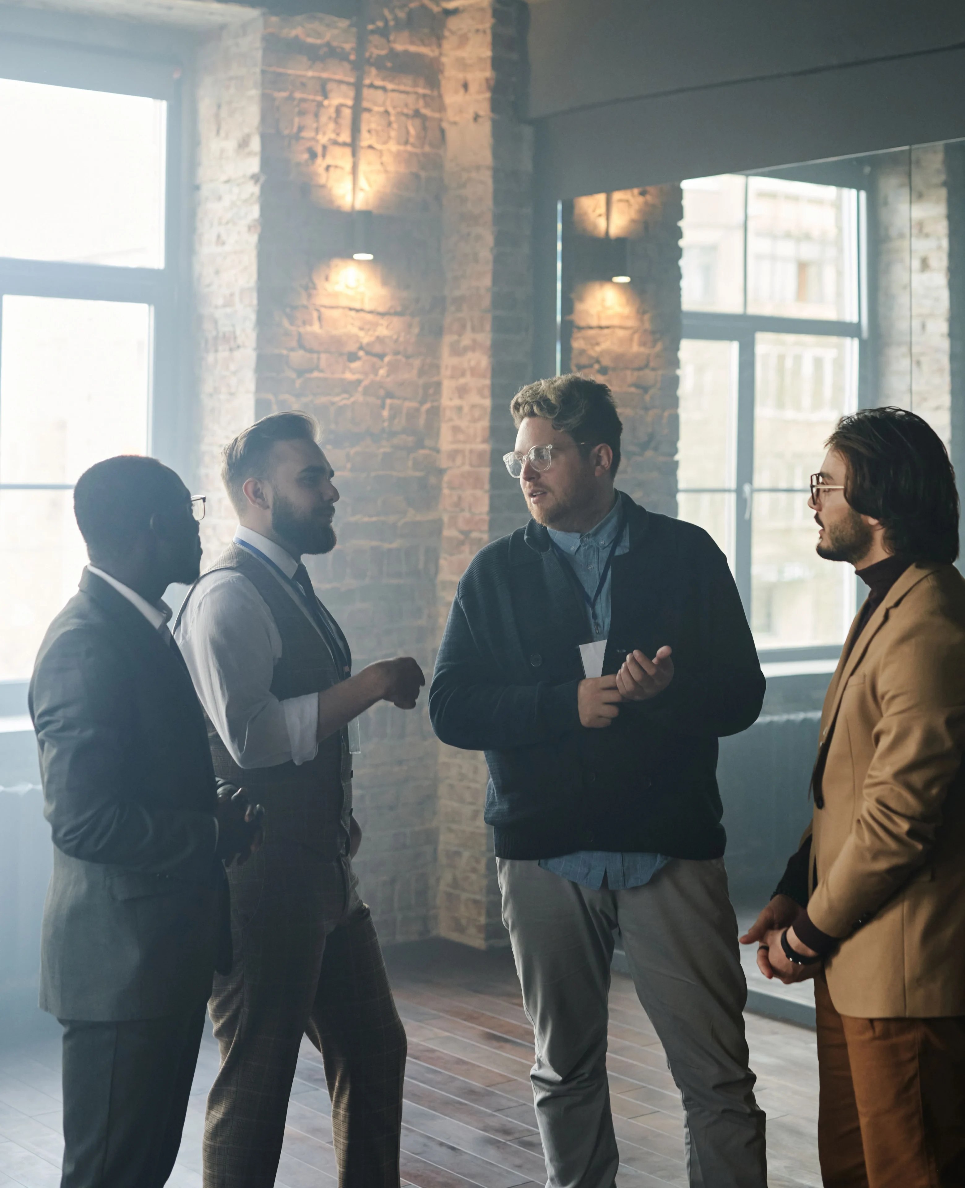 Four professionals having a discussion indoors
