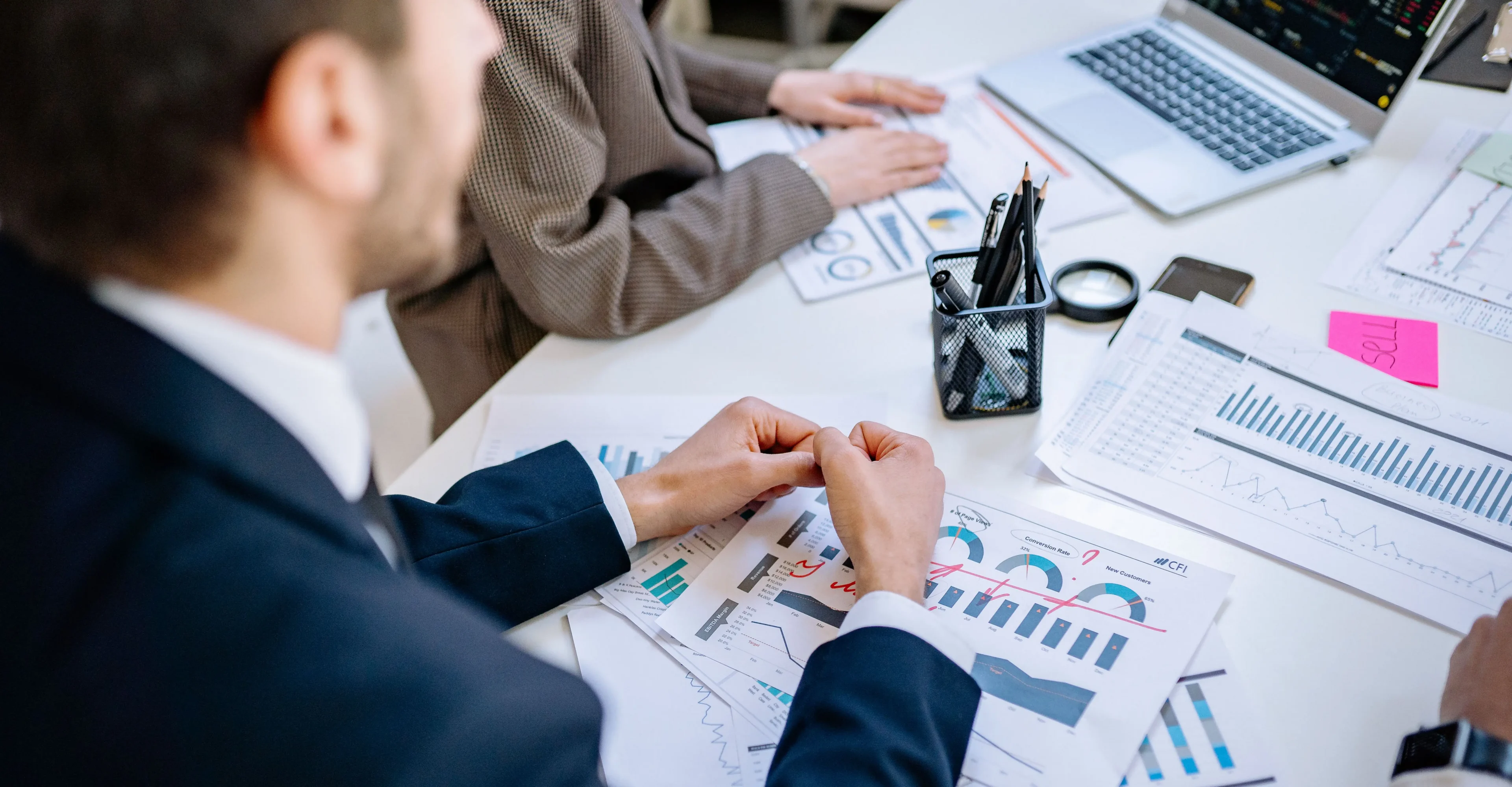 Business meeting with charts and graphs